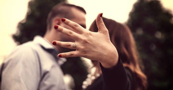 woman showing engagement ring image